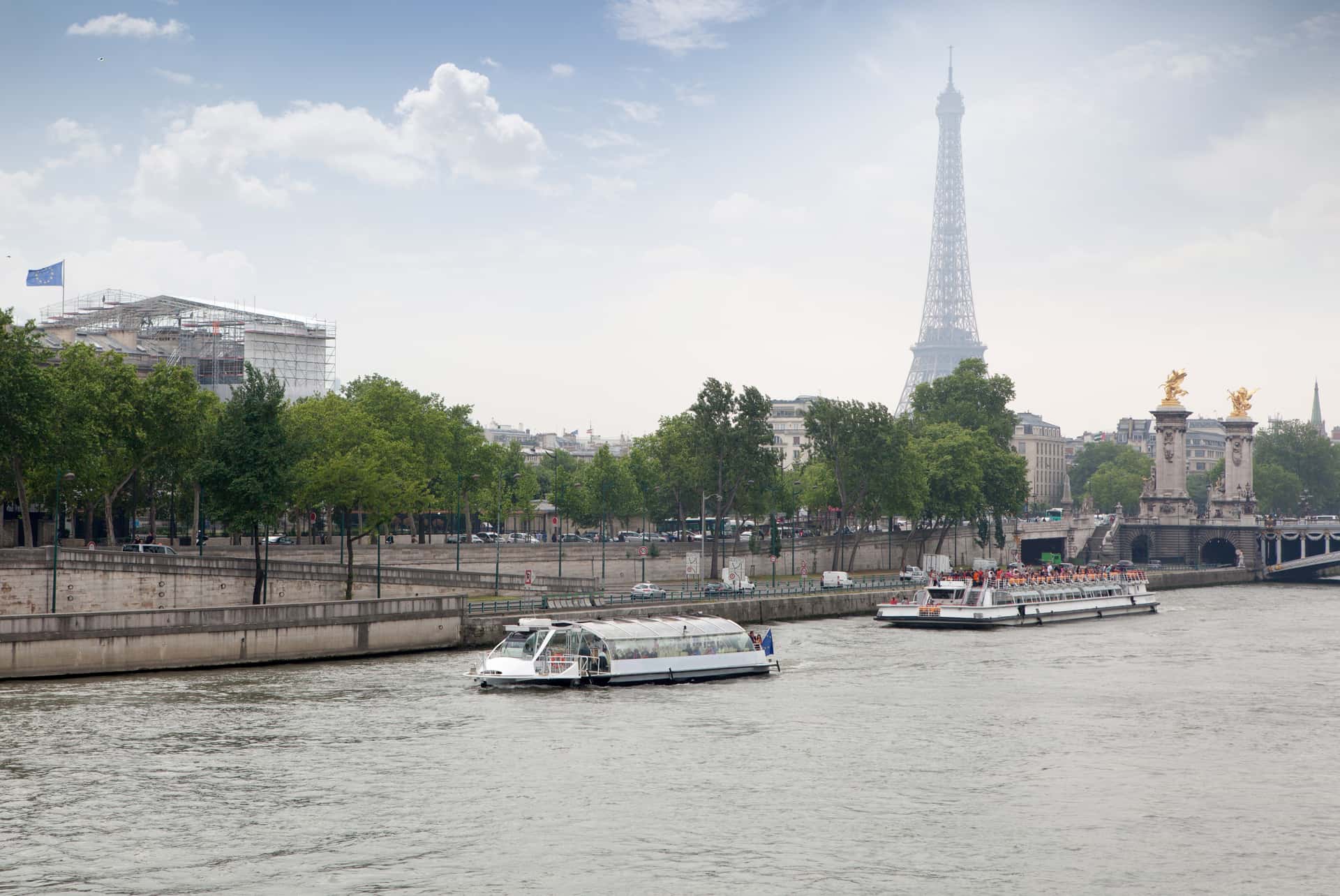 Take a boat tour of the Seine River in Europe tour packages from Delhi